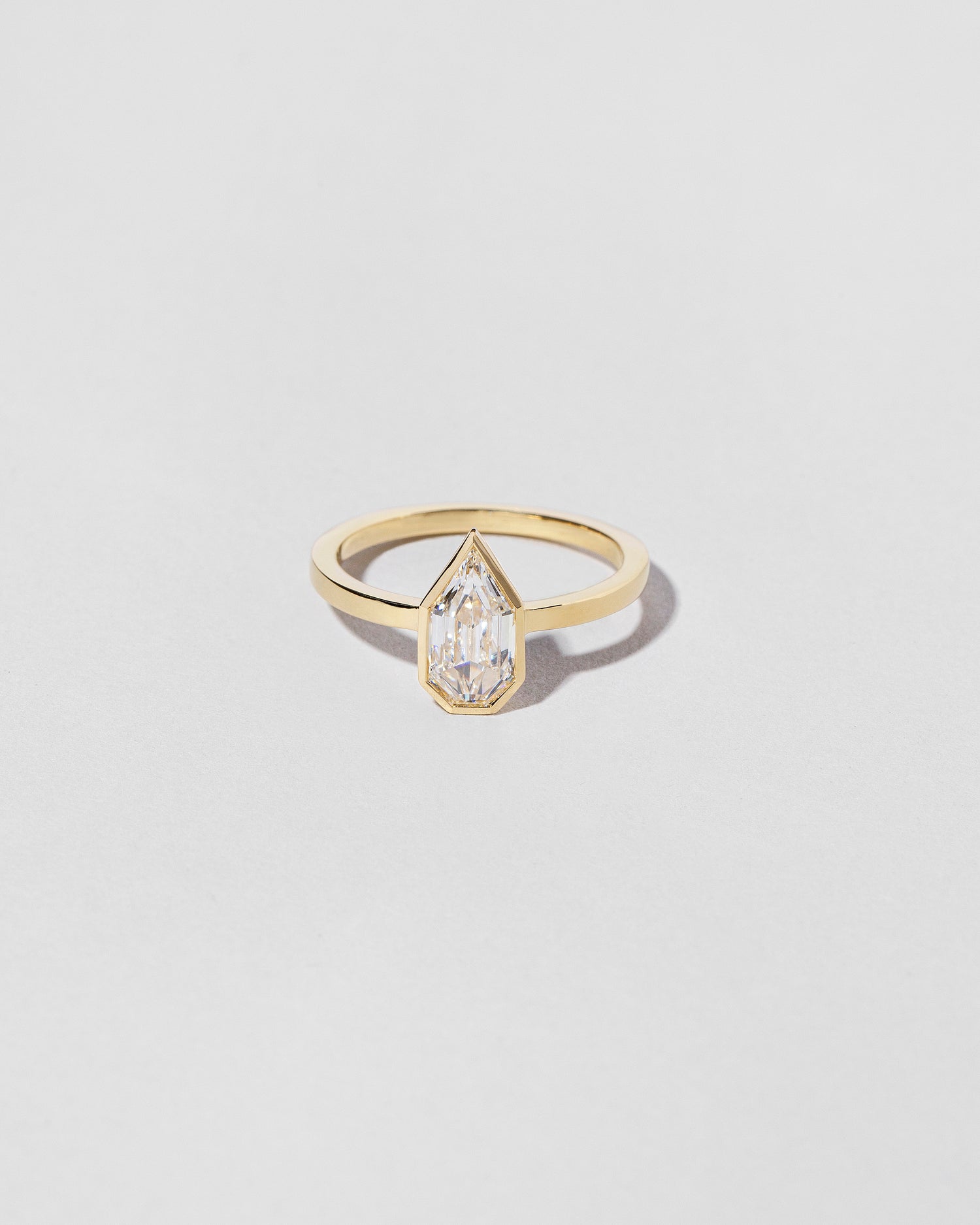 Modified Shield Step Cut Diamond Solitaire Ring front facing