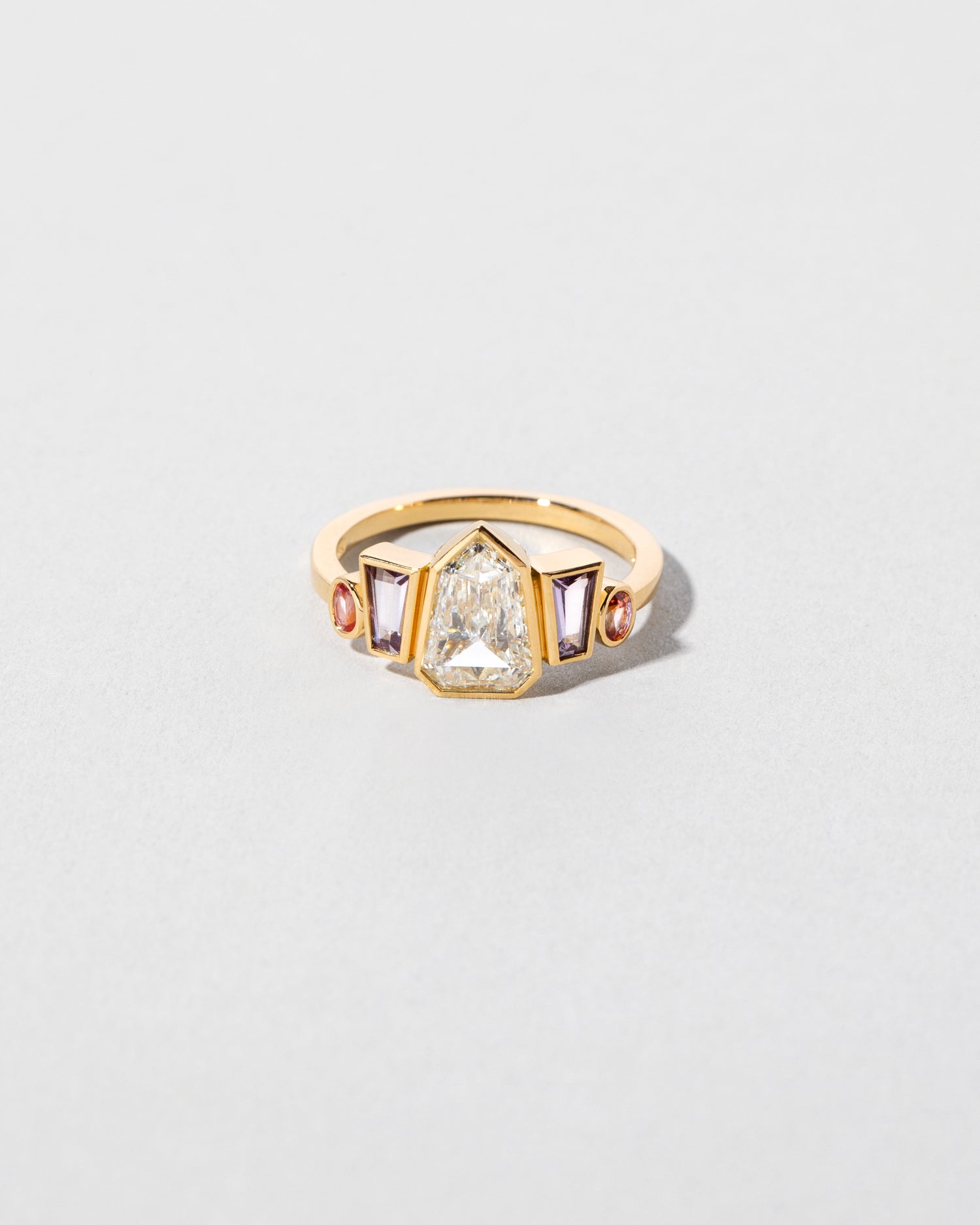 Shield Step Cut Diamond & Sapphire Line Cluster Ring front facing