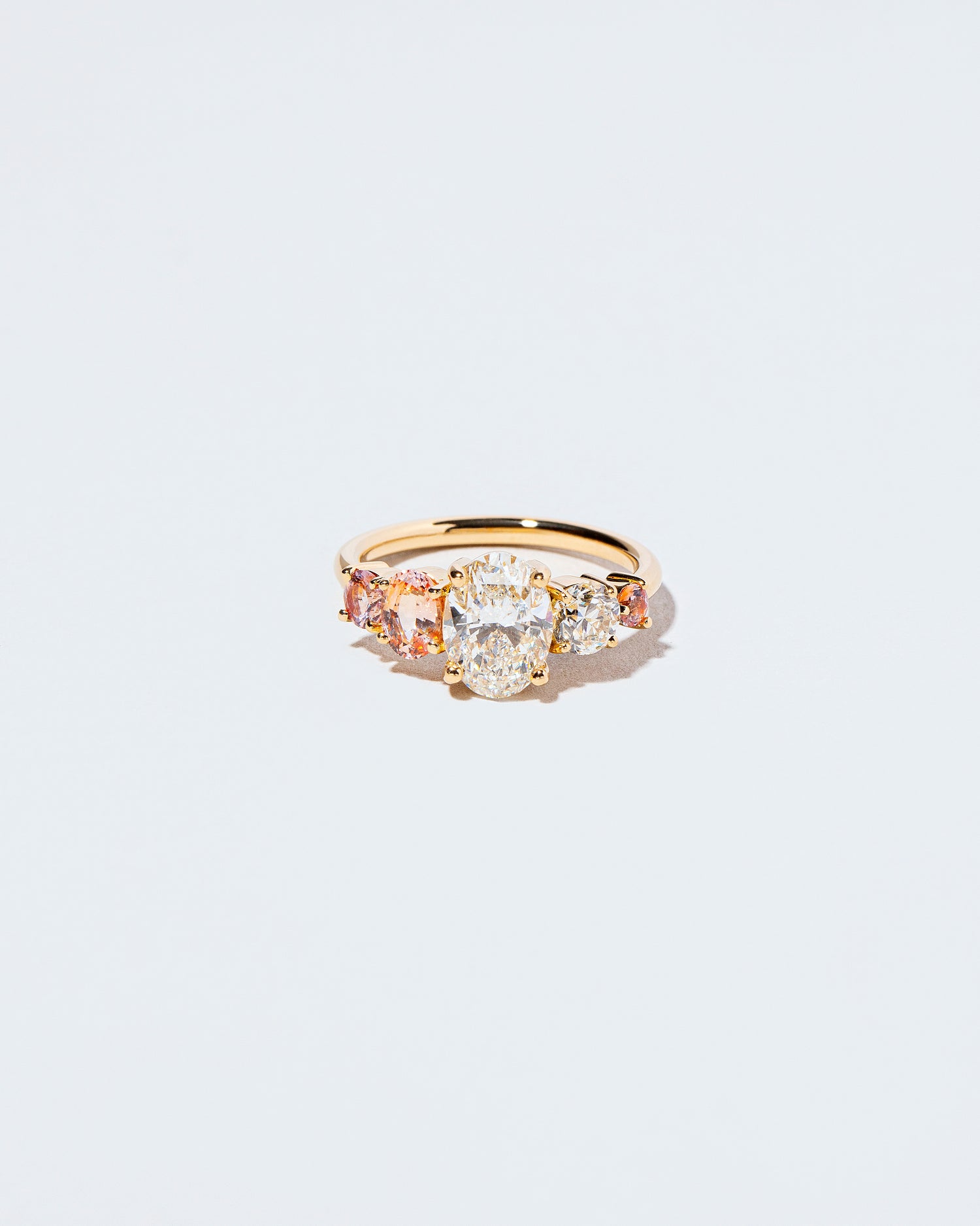 Brilliant Oval Diamond & Sapphire Line Cluster Ring front facing