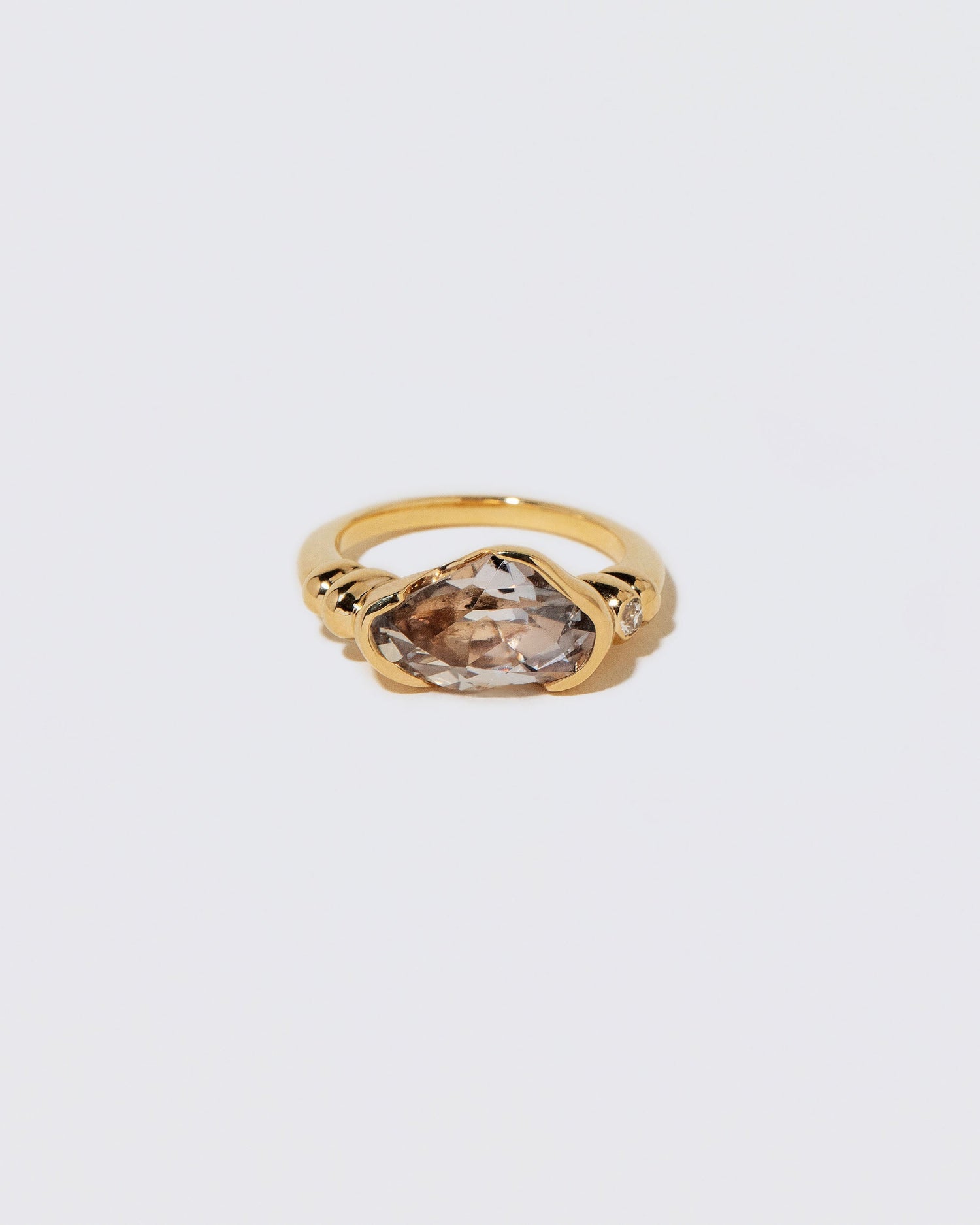 Custom by Mociun Top Notch Faceting Cut Madagascan Sapphire Ring on light color background.