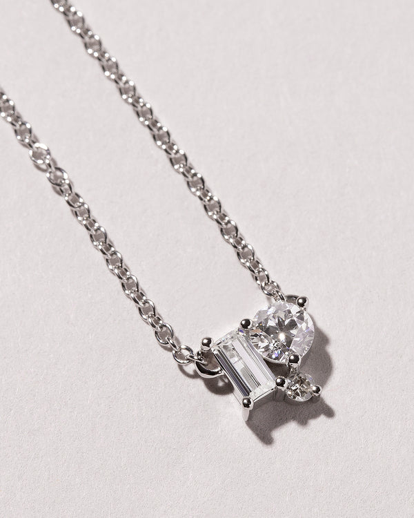 Three Stone Diamond Cluster Necklace laid flat
