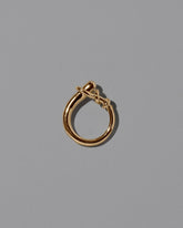 View from the side the of the CRZM Gold Terrane Ring on light color background.
