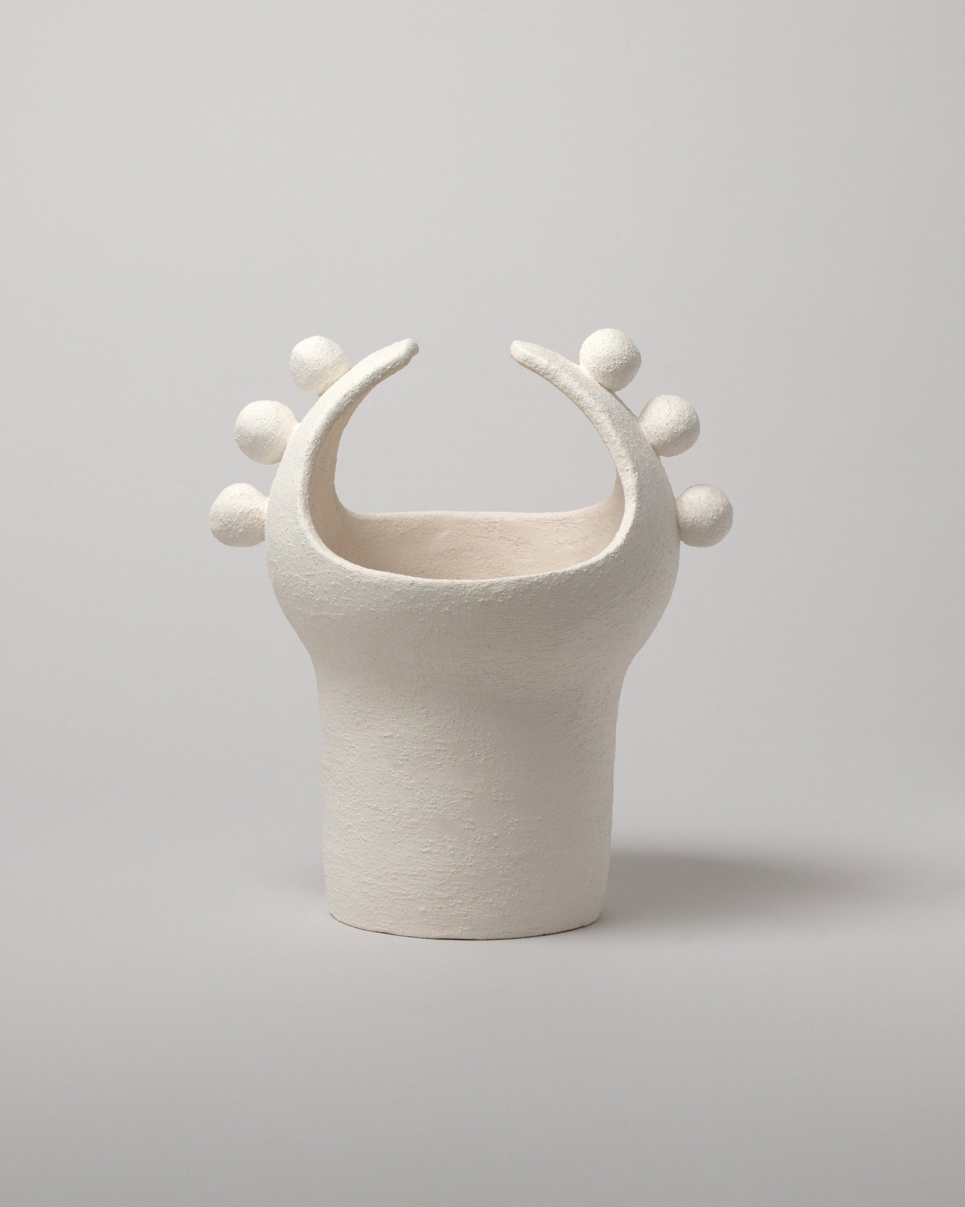 Stephanie Phillips White Moon Bulb Sculpture on light color background.