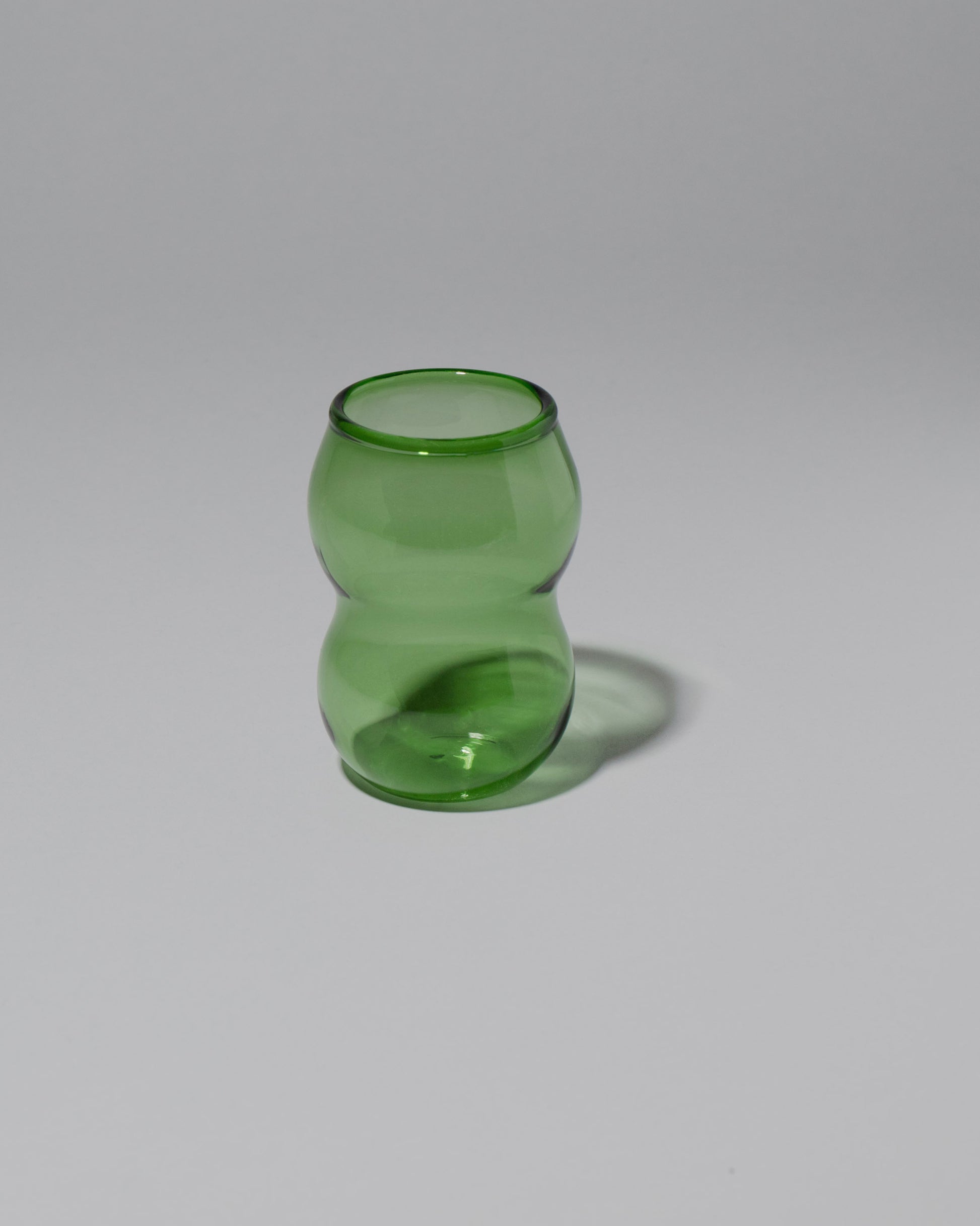Ornamental by Lameice Green Transparent Dreamlike Cup on light color background.