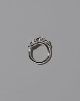 View from the side of the CRZM Sterling Silver Ophiolite Ring on light color background.