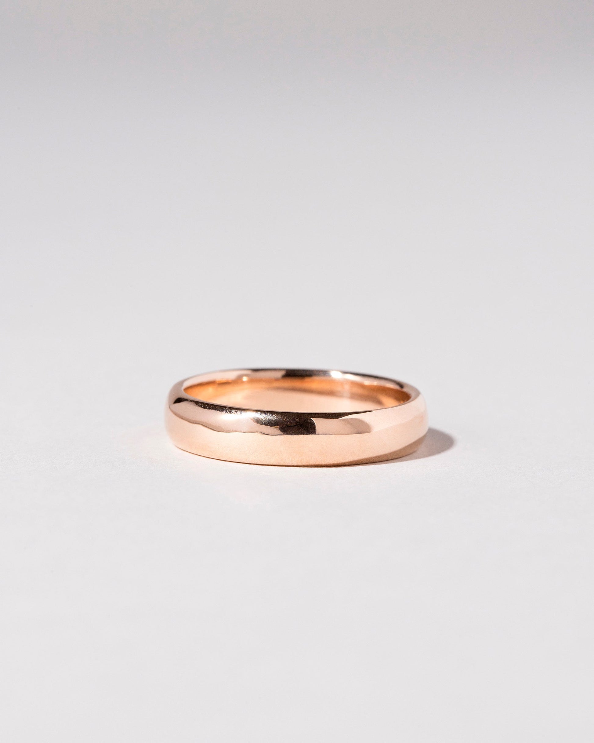 Rose Gold 5mm Half Round Band on light color background.