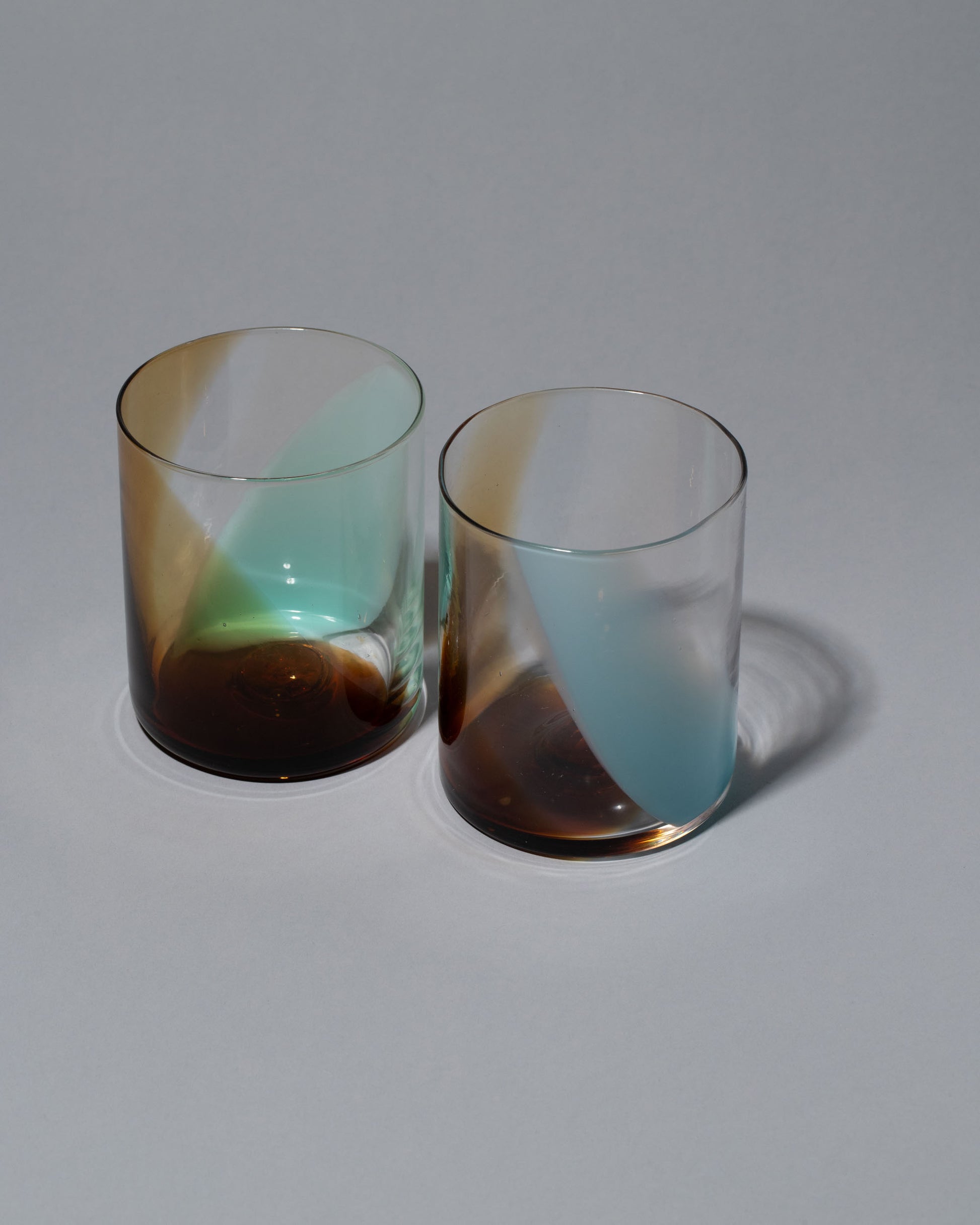 Group of Bow Glassworks Lakeside Splash Cups on light color background.