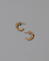 CRZM Gold Foothill Hoop Earrings on light color background.