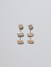 Kittiwake Earrings on light color background.