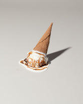 Spills Faux Chocolate Ice Cream Cone Spill on light color background.
