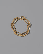 CRZM Gold Ophiolite Bracelet on light color background.