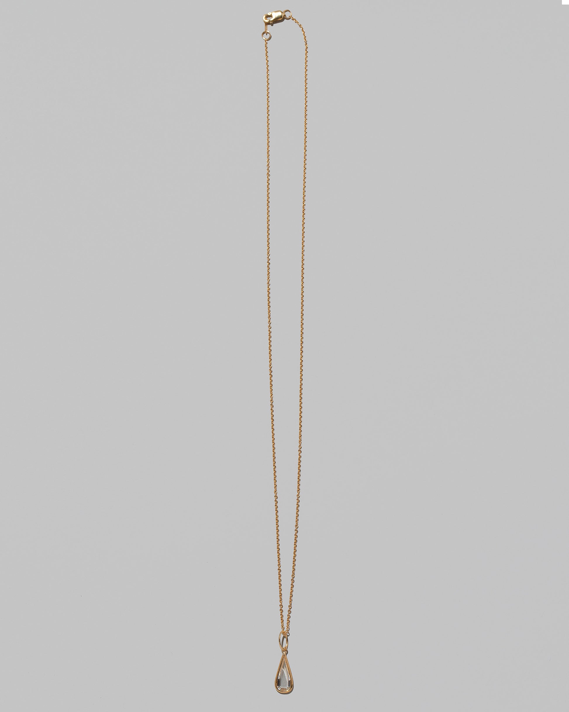 State Shifter Diamond Pendant paired with chain on light color background.