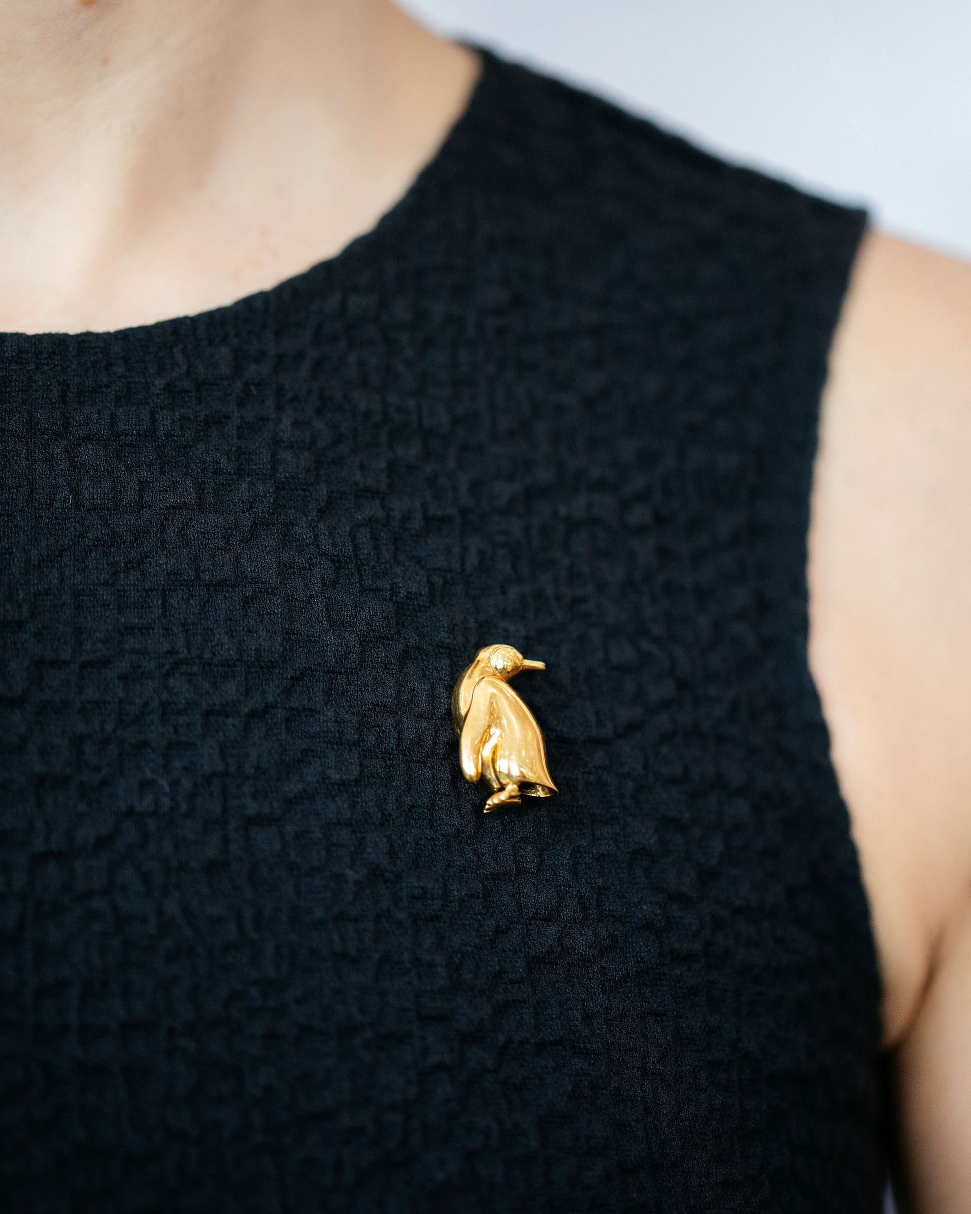 Vintage Tiffany & Co. Penguin Brooch on model.