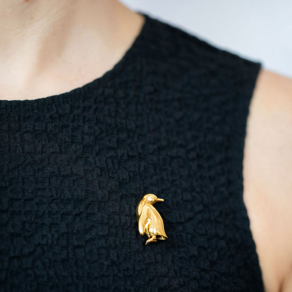 product_details::Vintage Tiffany & Co. Penguin Brooch on model.