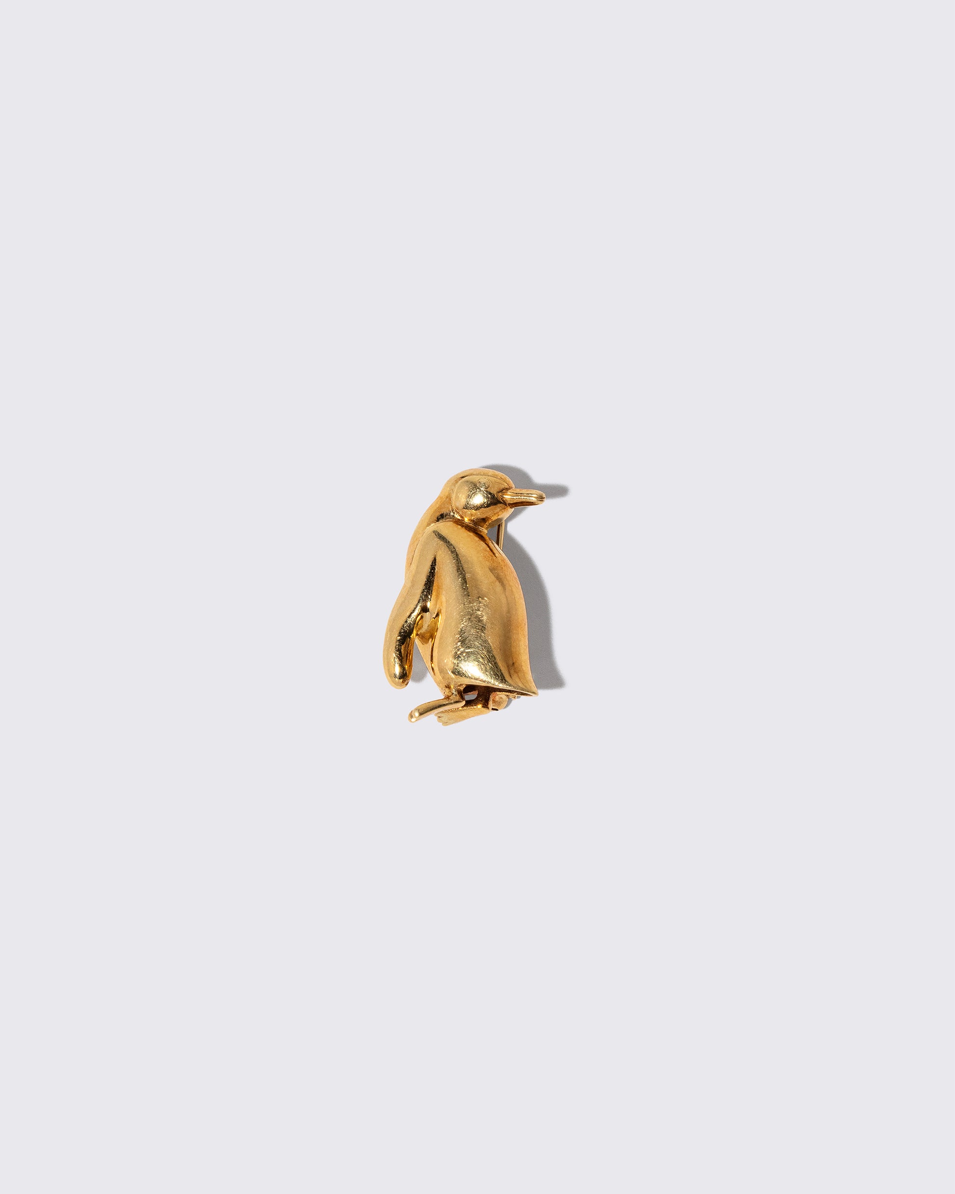 Vintage Tiffany & Co. Penguin Brooch on light color background.