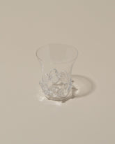 Closeup details of the Bollenglass Design Clear Liquor Glass on light color background.