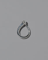 View from the side of the CRZM Sterling Silver Boulder Ring on light color background.