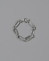 CRZM Sterling Silver Ophiolite Bracelet on light color background.