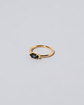 View from the side of the Deep Blue Ouvert Ring on light color background.