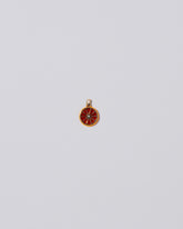 Large Tangerine Slice Charm on light color background.