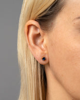 Gold Sapphire Fold Earrings on model.