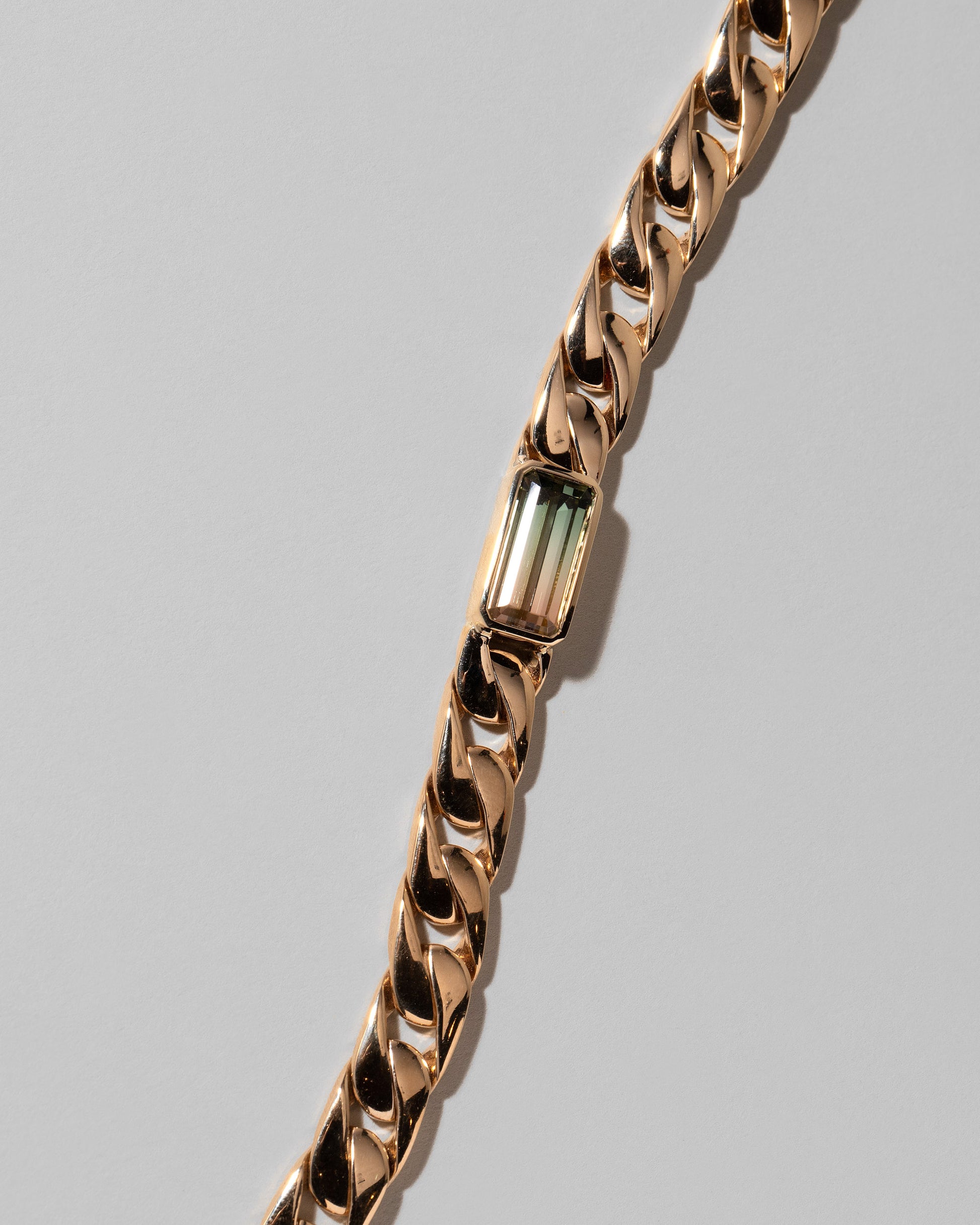 Closeup details of the Identity Chain Bicolor Tourmaline Bracelet 003 on light color background.