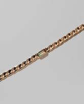 Closeup details of the Identity Chain Bicolor Tourmaline Bracelet 003 on light color background.
