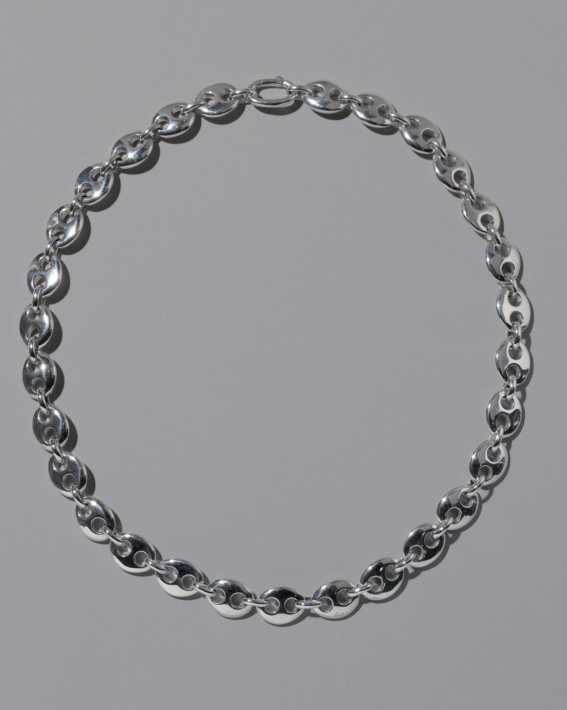 CRZM Sterling Silver Bedrock Necklace on light color background.