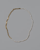 Rice Pearl Long Oval Necklace on light color background.