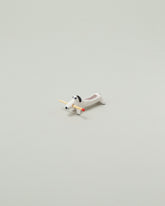 Eleonor Boström Mini Matchstick Dog on light color background.