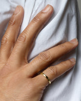 Gold 2.5mm Etched Lines Band on male model.