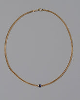 Blue Sapphire Fold Necklace on grey color background.