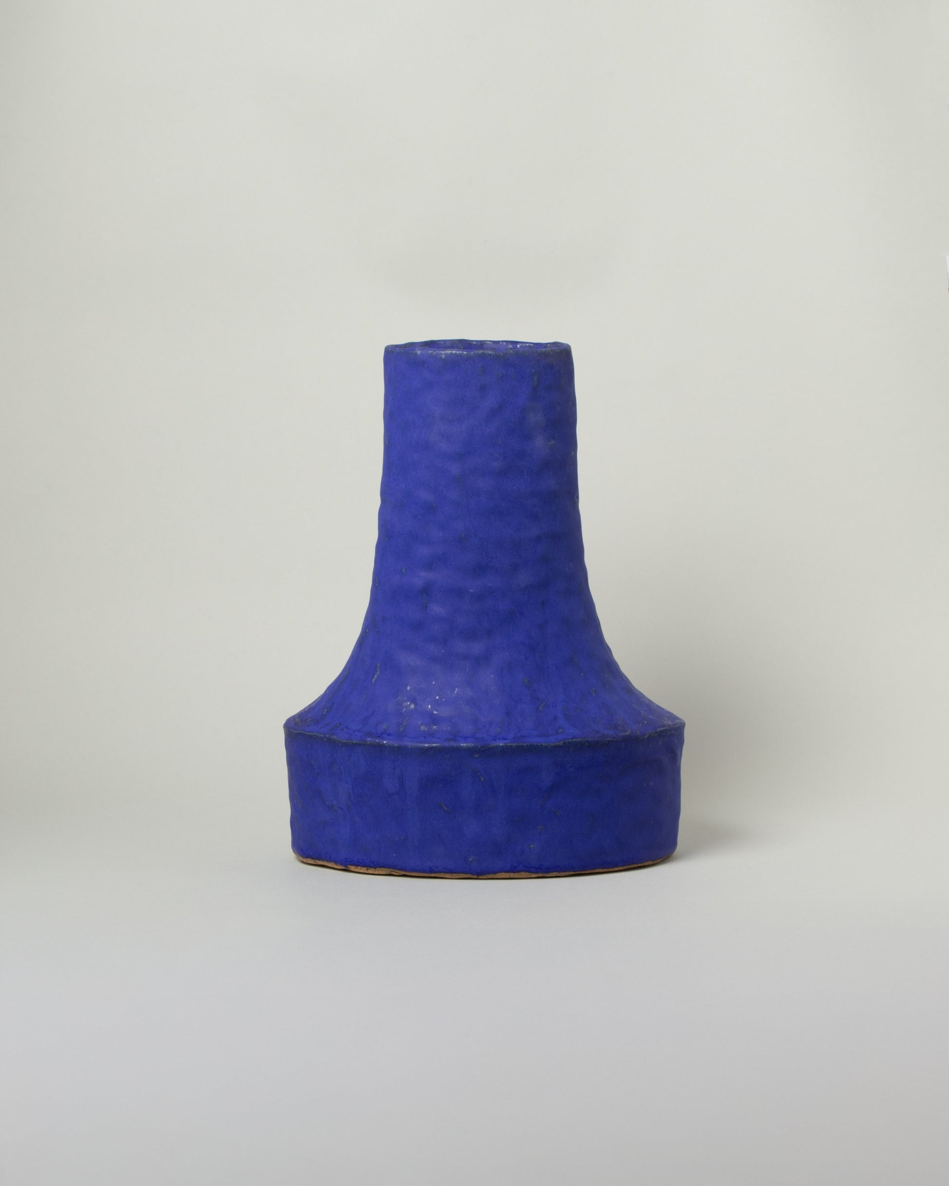 Giselle Hicks Cobalt Blue Oval Swoop Vessel on light color background.