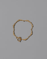 CRZM Gold Foothill Bracelet on light color background.