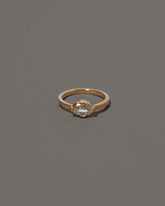 Beholden Ring on grey color background.