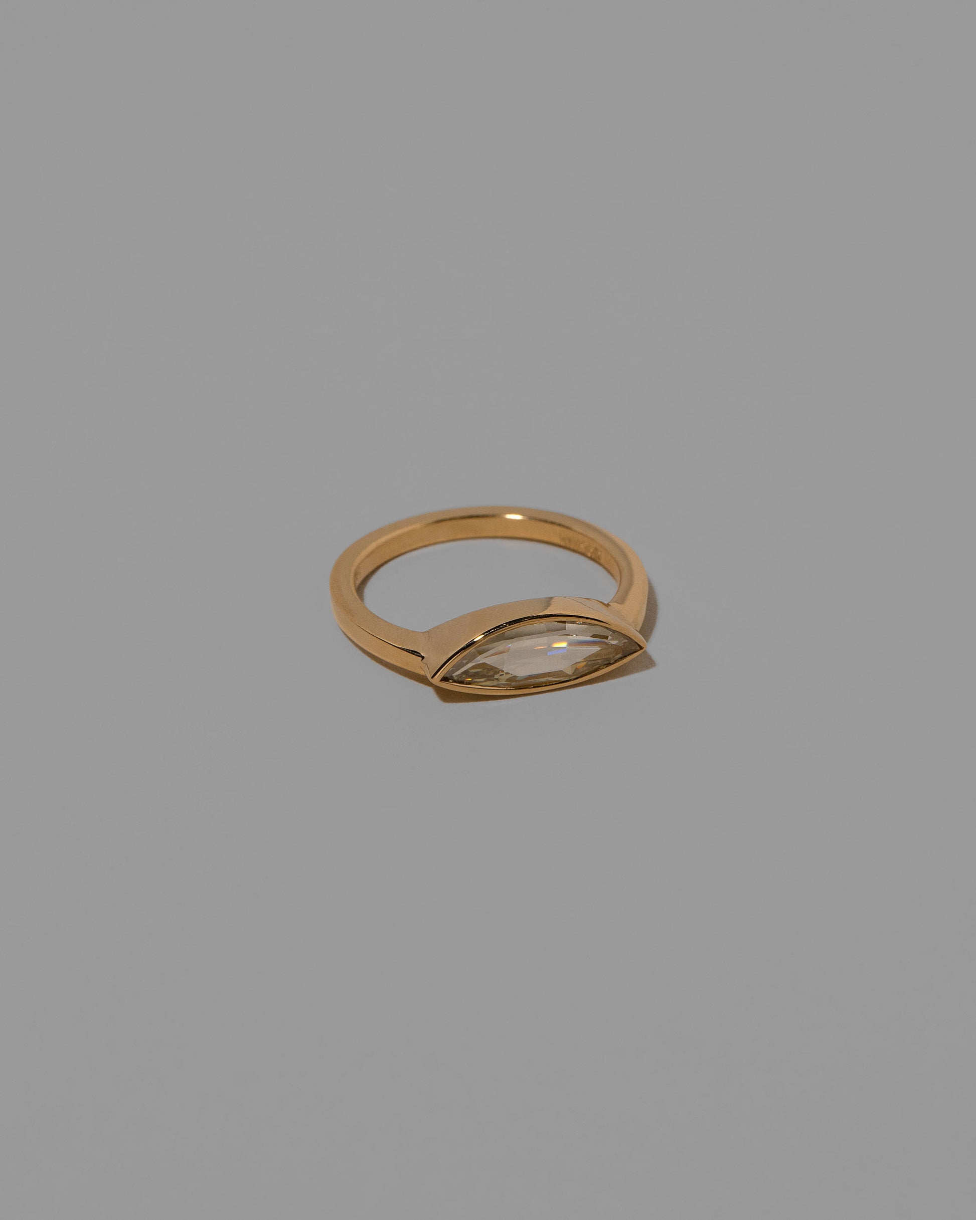 View from the side of the Tenderness Ring on light color background.