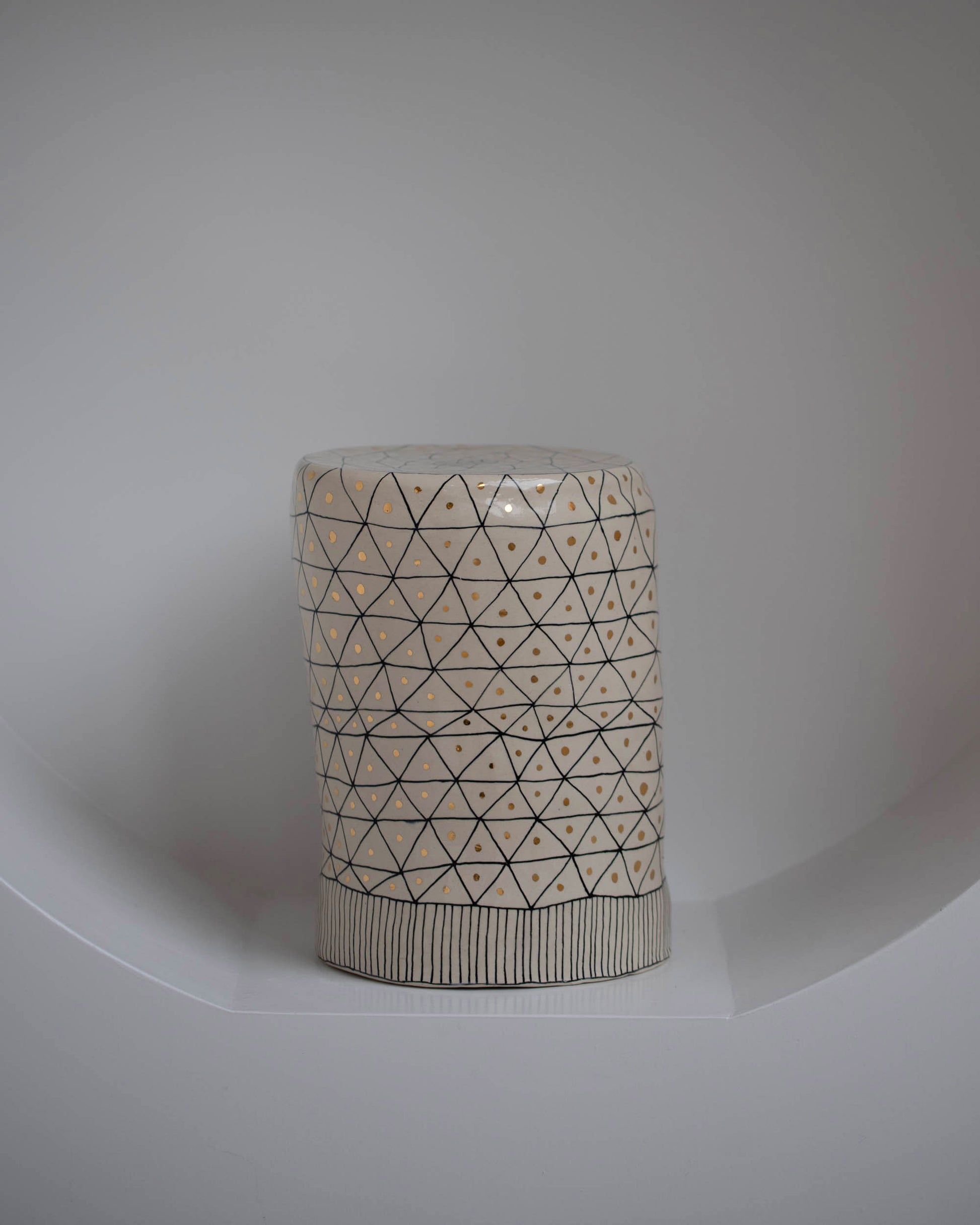 Styled image of the Suzanne Sullivan No Nonsense Reliability Plant Stand on light color background. 