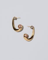 Channeling Hoop Earrings on light color background.