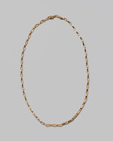 Flat Oval Link Chain Necklace on light color background.