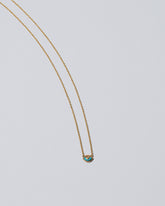 Eye See You Necklace on light color background.