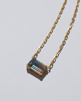 Closeup details of the Highest Path Necklace on light color background.