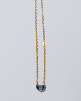 Reverence Necklace on light color background.
