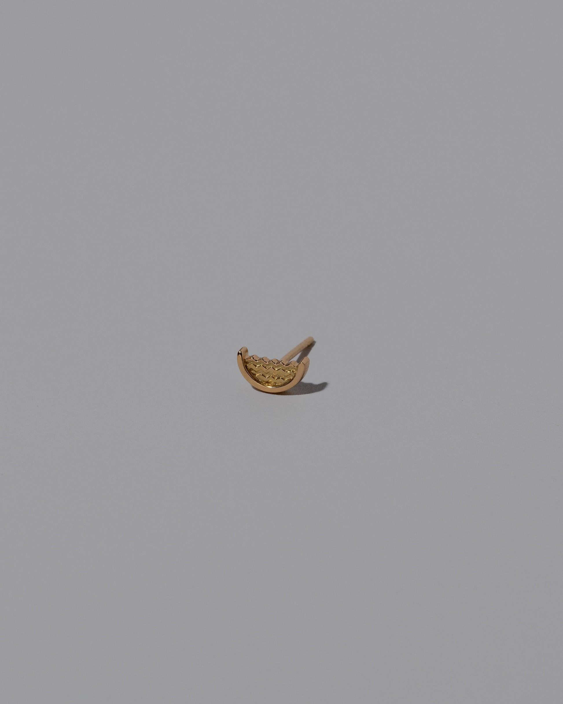 Water Stud Earring Single on light color background.