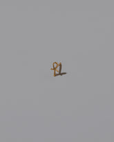 Ankh Stud Earring Single on light color background.