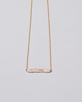 Stick Pearl Necklace on light color background.