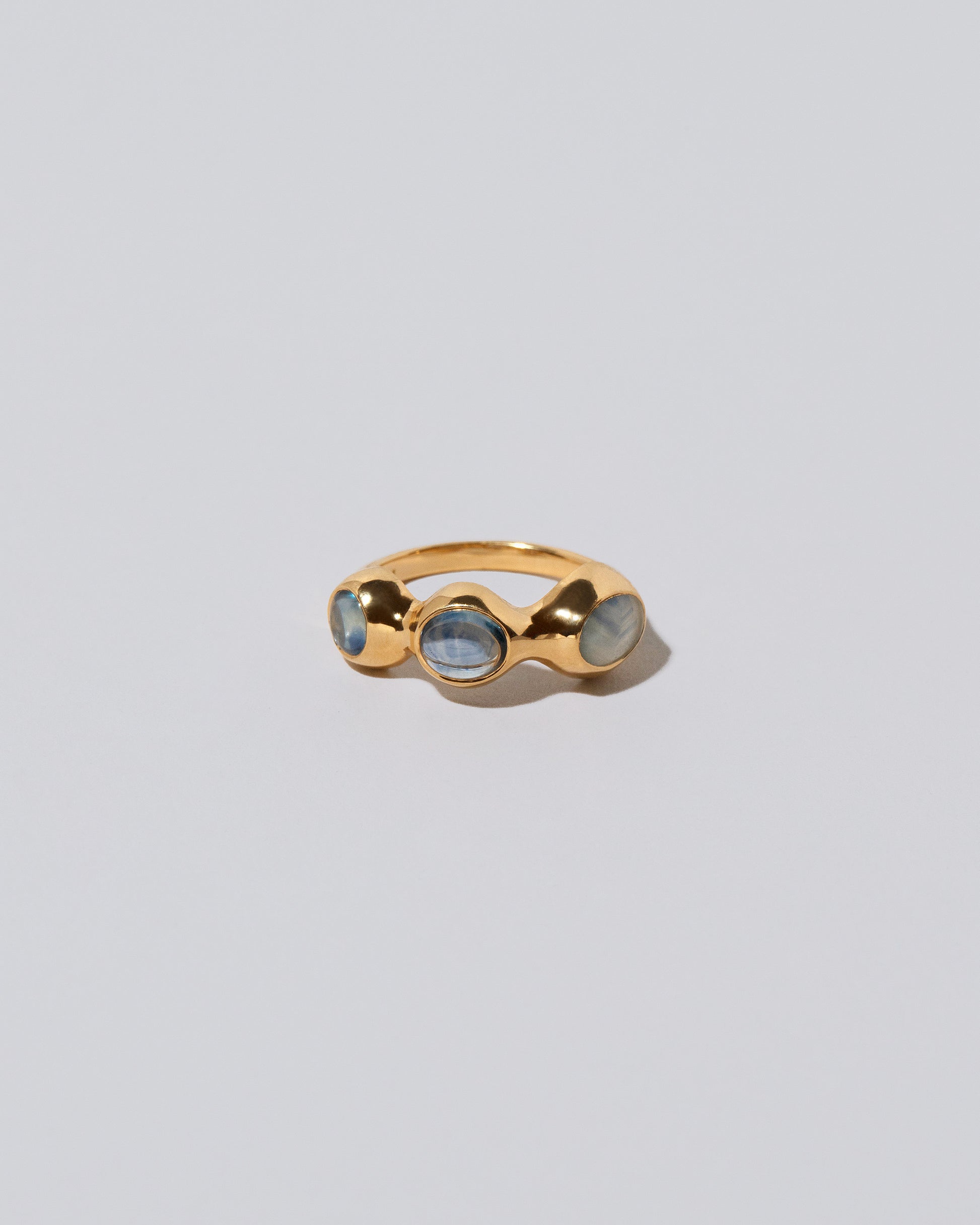 Sword Swallower Ring on light color background.