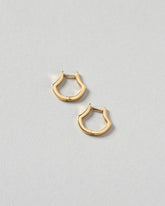 Madrone Flower Bud Hoop Earrings on light color background.