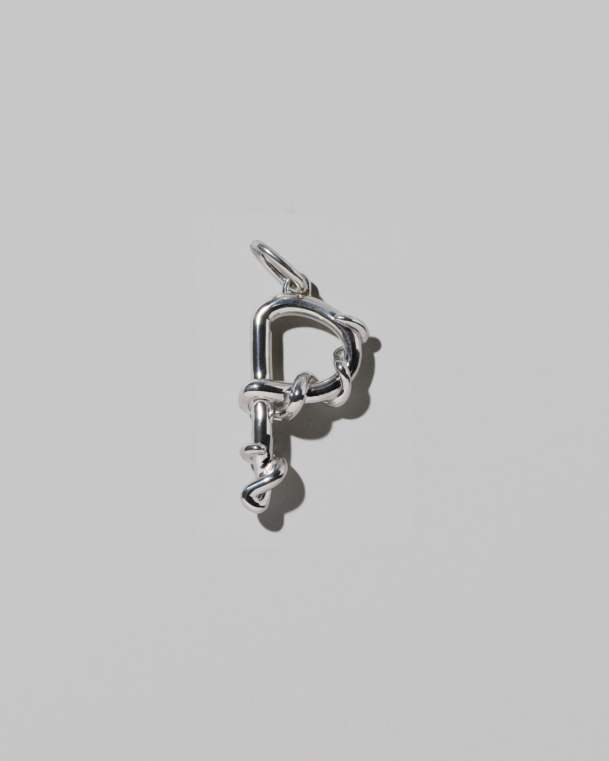 CRZM Large Letter P Charm set in sterling silver on light color background.