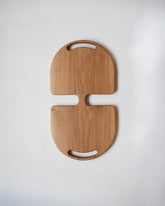Lucas Castex No. 12 Hand-Carved Oak Wood Serving Board on light color background.