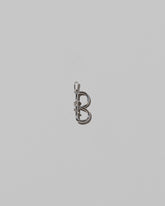 CRZM Medium Letter B Charm set in sterling silver on light color background.